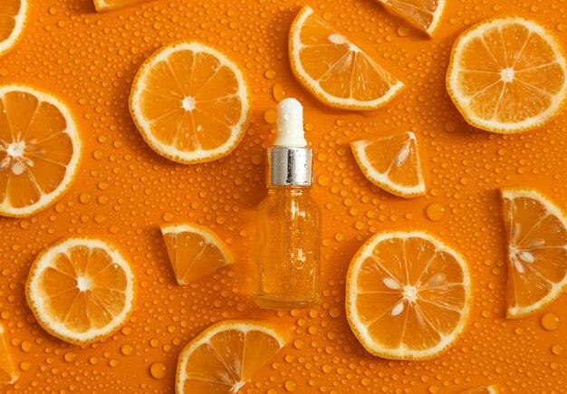 bottle-cosmetics-drops-liquid-moisturizing-orange-hyaluronic-acid-selective-focus_73944-27358